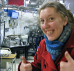 Female student with thumbs up in a lab